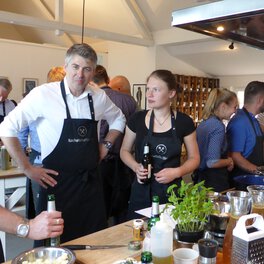 Photo of Böllhoff employees at the buffet they have cooked together