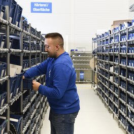 Photo of a warehouse logistics specialist at work sorting