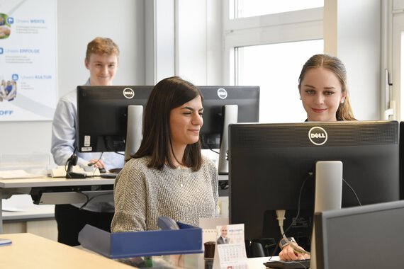 Photo of three Böllhoff employees in an office
