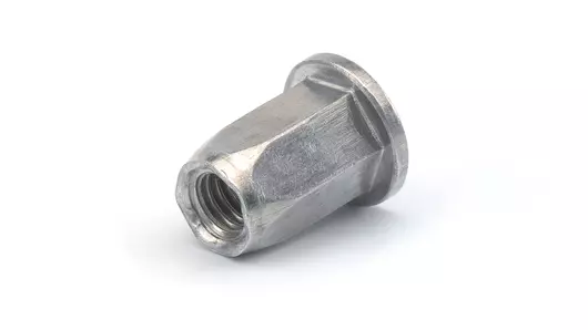 Image of an open RIVKLE® blind rivet nut made from steel, with hexagonal shaft and flat head