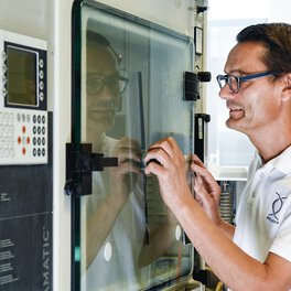 Employees at the accredited test laboratory carrying out a salt spray test