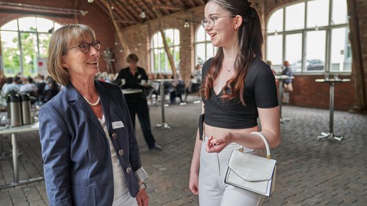 Pupil in conversation with a godmother