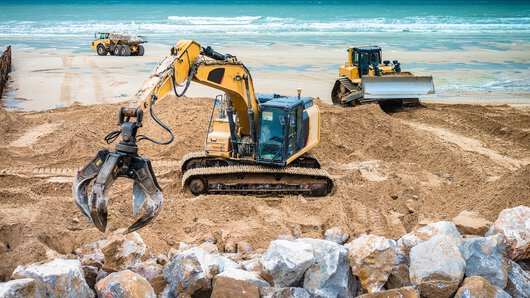 A construction site in action on the beach