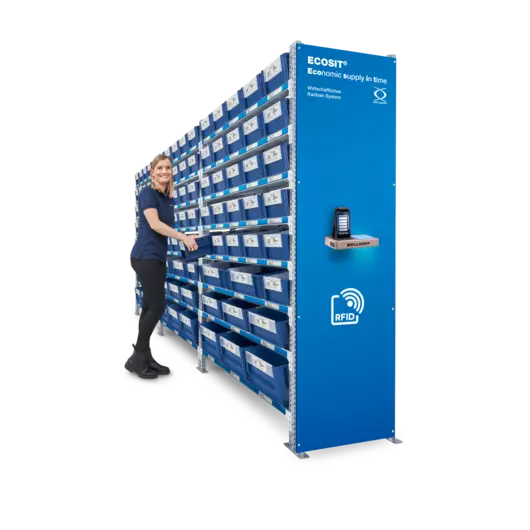 A woman standing at the control centre of an ECOSIT® system is reaching for a Kanban ECOBIN.