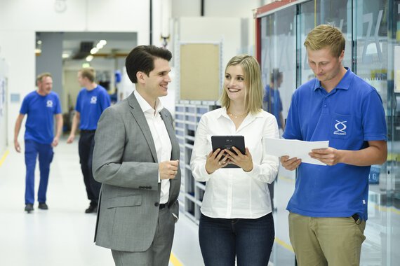 Group photo of several Böllhoff employees from different departments